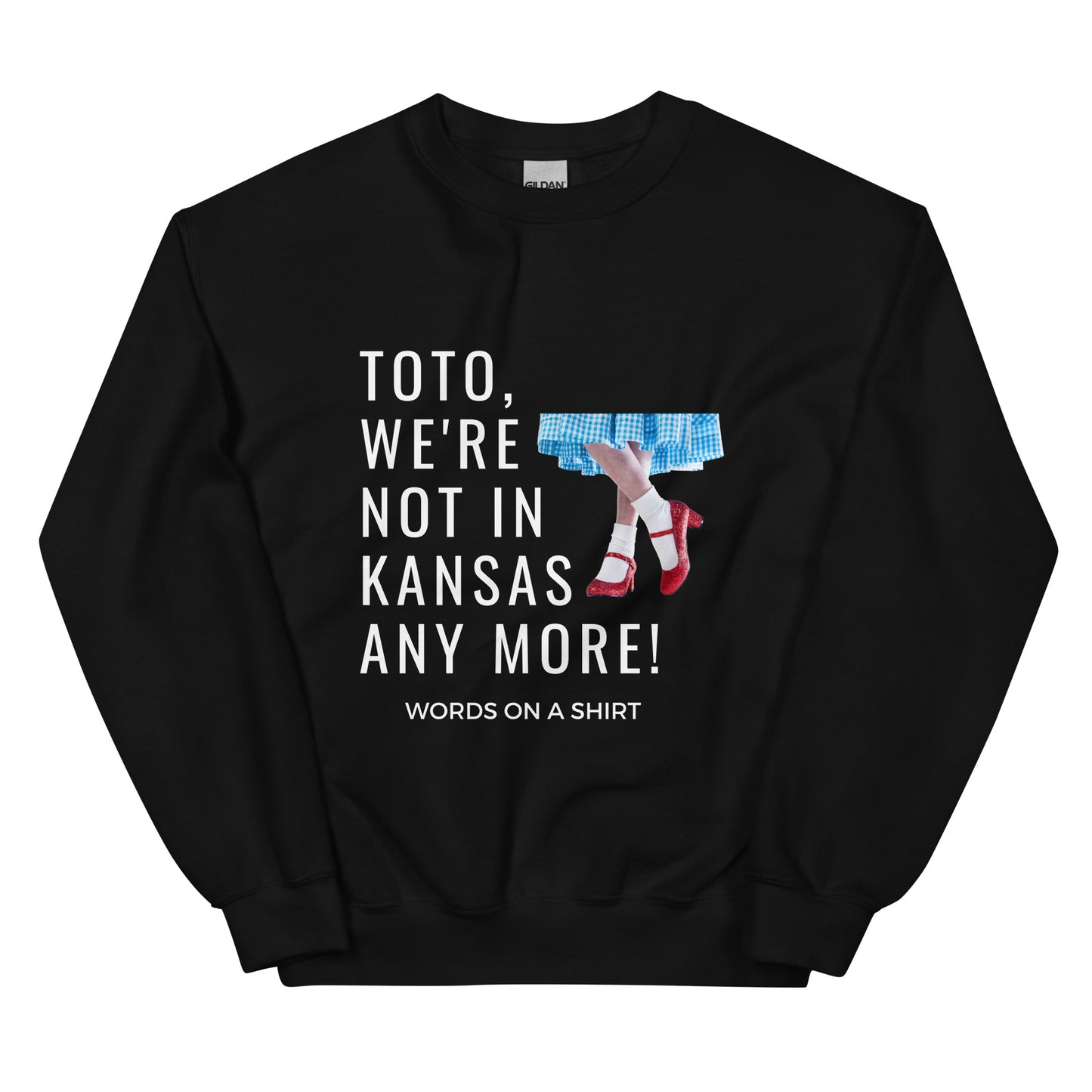 Cozy up in this durable and snug sweatshirt, perfect for chilly days. This pre-shrunk, traditional cut sweater features air-jet spun yarn for a cozy touch and less pilling. And with the iconic quote from The Wizard of Oz, "Toto, We're Not In Kansas Anymore," you'll be ready for any adventure!
