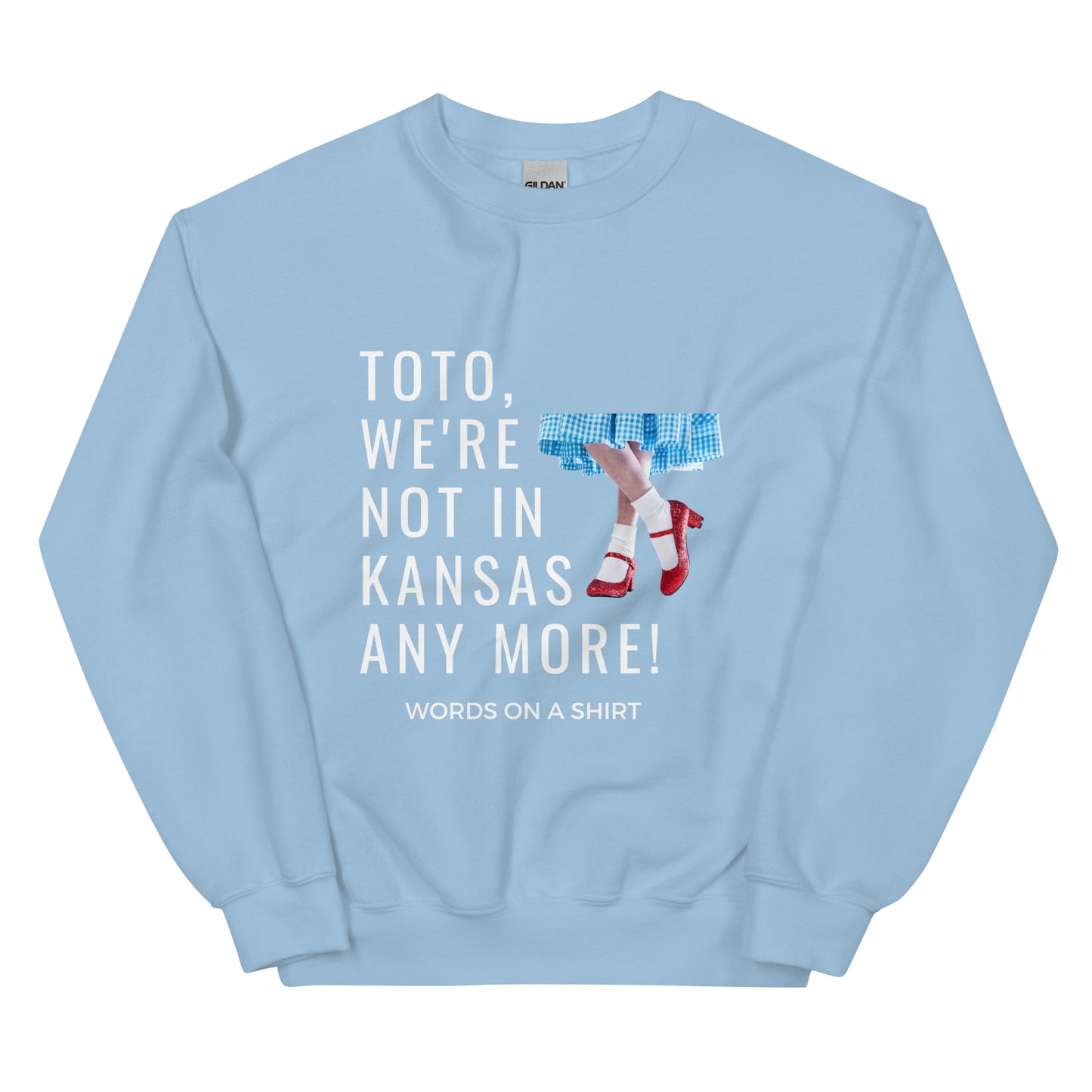 Cozy up in this durable and snug sweatshirt, perfect for chilly days. This pre-shrunk, traditional cut sweater features air-jet spun yarn for a cozy touch and less pilling. And with the iconic quote from The Wizard of Oz, "Toto, We're Not In Kansas Anymore," you'll be ready for any adventure!
