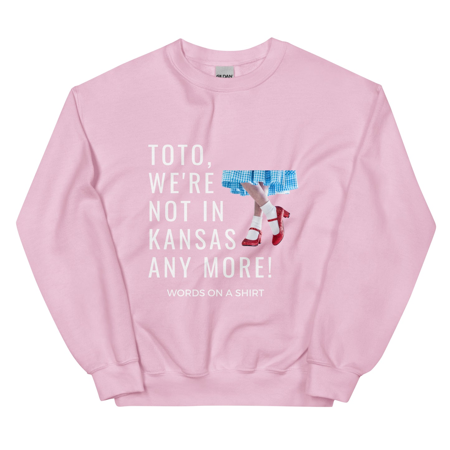 Cozy up in this durable and snug sweatshirt, perfect for chilly days. This pre-shrunk, traditional cut sweater features air-jet spun yarn for a cozy touch and less pilling. And with the iconic quote from The Wizard of Oz, "Toto, We're Not In Kansas Anymore," you'll be ready for any adventure!