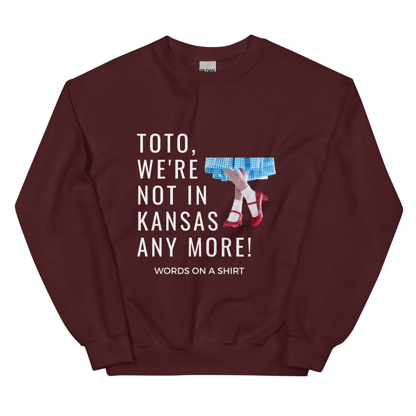 Cozy up in this durable and snug sweatshirt, perfect for chilly days. This pre-shrunk, traditional cut sweater features air-jet spun yarn for a cozy touch and less pilling. And with the iconic quote from The Wizard of Oz, "Toto, We're Not In Kansas Anymore," you'll be ready for any adventure!
