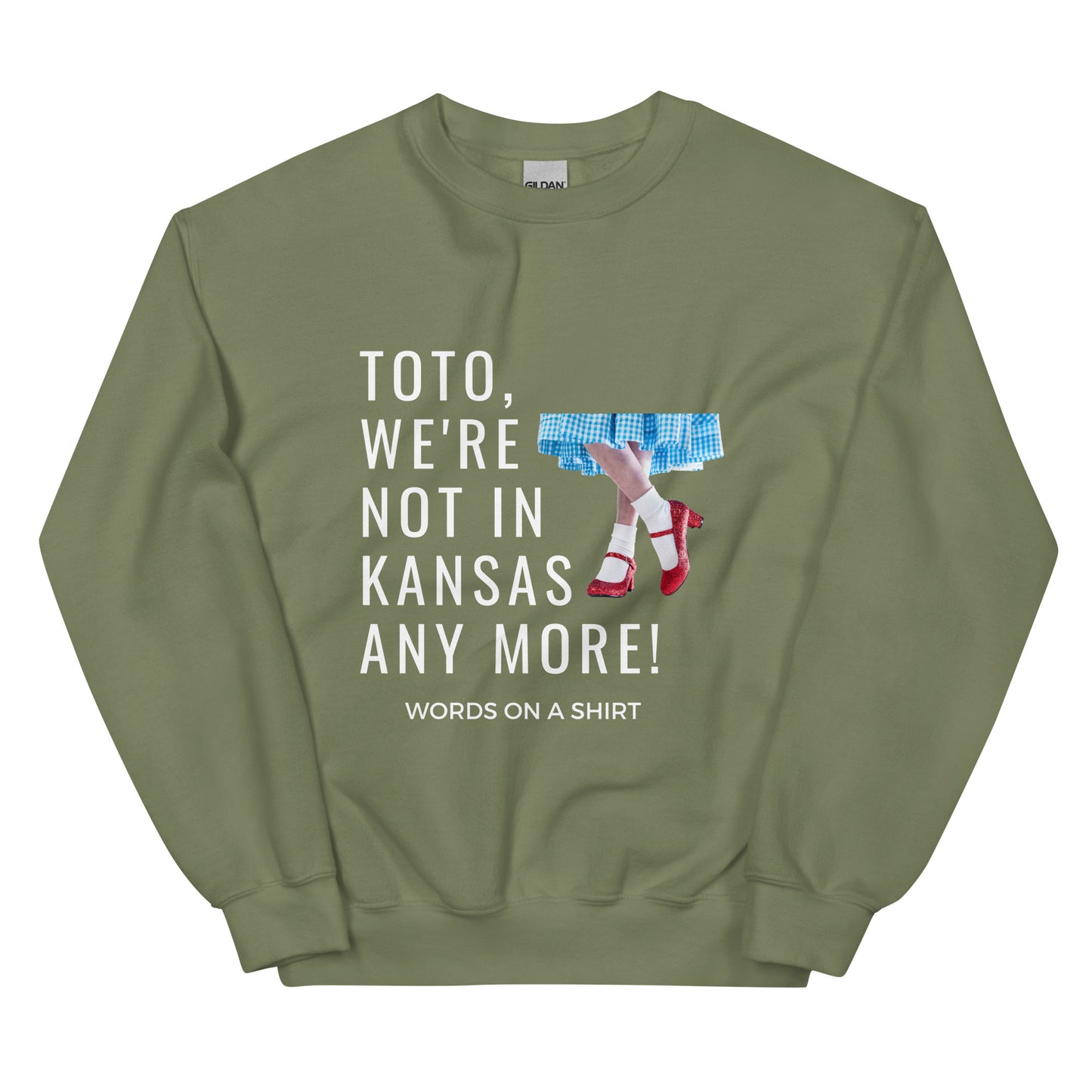 Cozy up in this durable and snug sweatshirt, perfect for chilly days. This pre-shrunk, traditional cut sweater features air-jet spun yarn for a cozy touch and less pilling. And with the iconic quote from The Wizard of Oz, "Toto, We're Not In Kansas Anymore," you'll be ready for any adventure!
