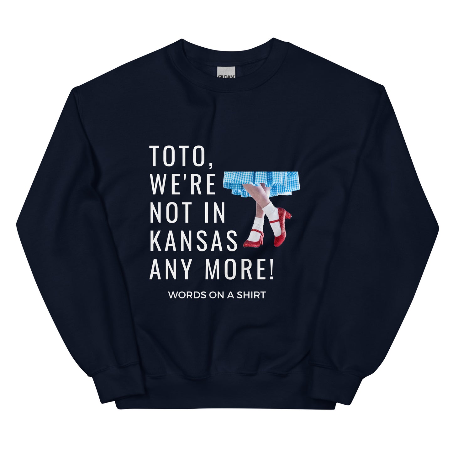 Cozy up in this durable and snug sweatshirt, perfect for chilly days. This pre-shrunk, traditional cut sweater features air-jet spun yarn for a cozy touch and less pilling. And with the iconic quote from The Wizard of Oz, "Toto, We're Not In Kansas Anymore," you'll be ready for any adventure!