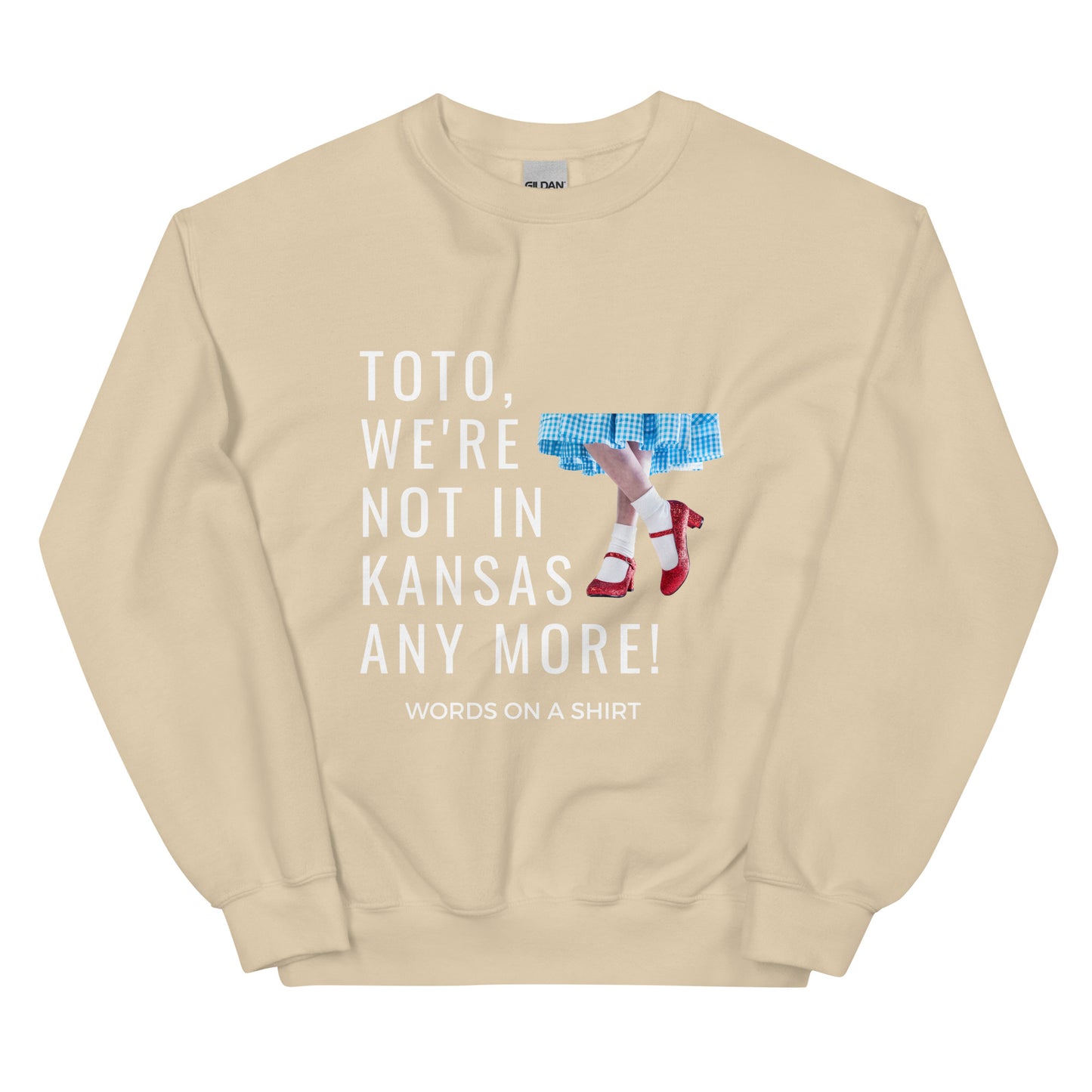 Cozy up in this durable and snug sweatshirt, perfect for chilly days. This pre-shrunk, traditional cut sweater features air-jet spun yarn for a cozy touch and less pilling. And with the iconic quote from The Wizard of Oz, "Toto, We're Not In Kansas Anymore," you'll be ready for any adventure!