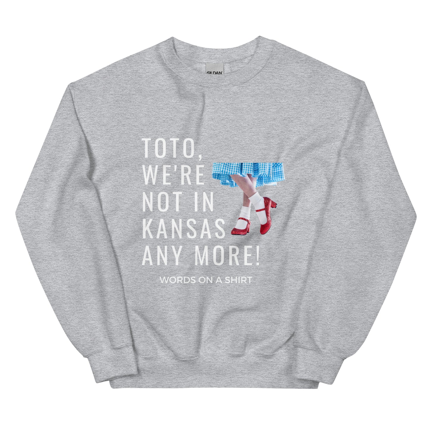 Cozy up in this durable and snug sweatshirt, perfect for chilly days. This pre-shrunk, traditional cut sweater features air-jet spun yarn for a cozy touch and less pilling. And with the iconic quote from The Wizard of Oz, "Toto, We're Not In Kansas Anymore," you'll be ready for any adventure!