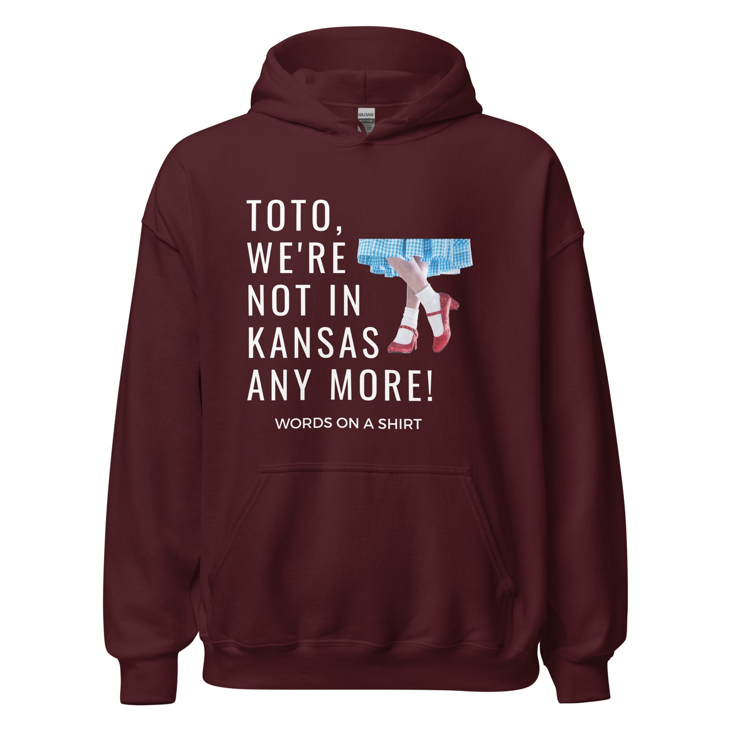 Get your hands on a cozy go-to hoodie that'll keep you comfortable and looking cool. Perfect for those chilly nights! Featuring the famous Wizard Of Oz quote, "Toto, We're Not In Kansas Anymore."