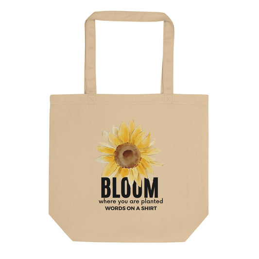 Pack your goodies in our Bloom Where You Are Planted- Eco Tote Bag for your wildest grocery excursions, library runs, or everyday escapades. This all-natural cotton tote is a planet-friendly substitute for plastic, and it fits just the right amount. Take a stand against plastic and let your roots grow deep!